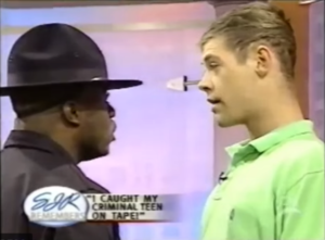 Sgt. Julu gets up close and personal with an unruly teen on The Sally Jessy Raphael Show.